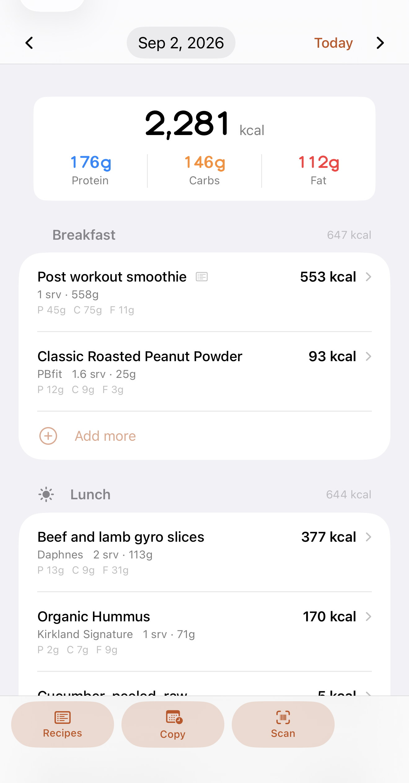 A day's food log, grouped by meal, with calories and macros on every item